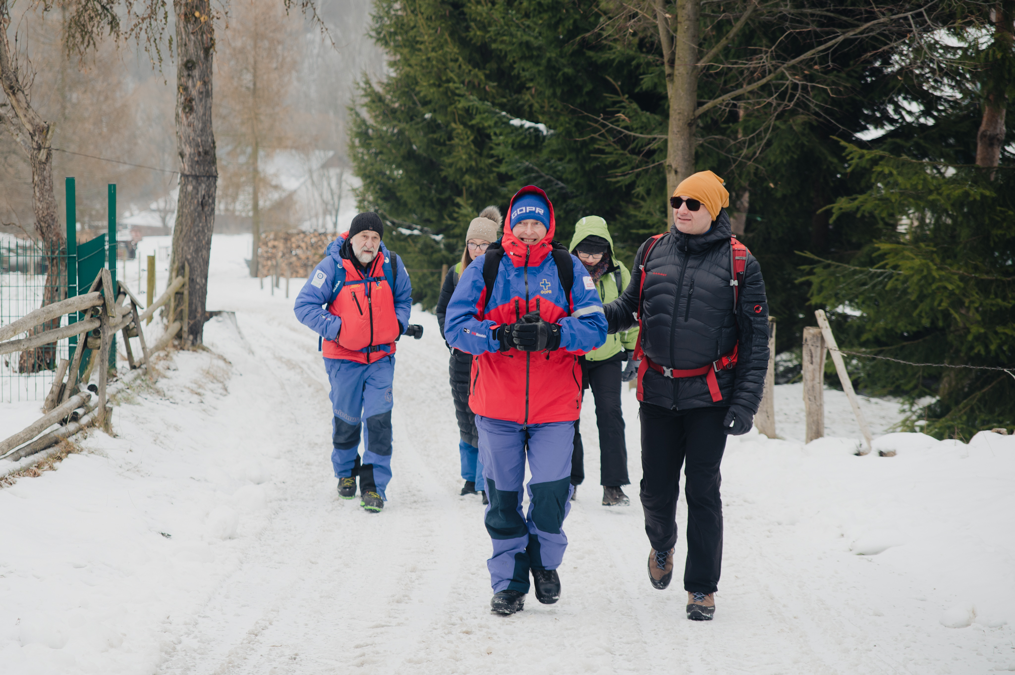 Mountain lifeguards and trainers walking Olchowiec mountain trail.